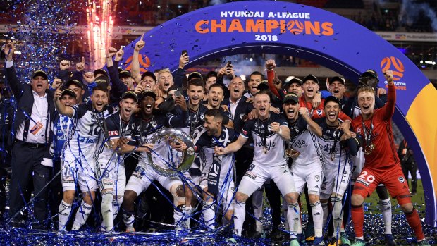 Winners: Melbourne Victory claimed the A-League champions trophy under a cloud of controversy.