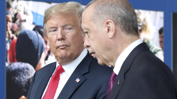 Donald Trump, left, talks to Recep Tayyip Erdogan as they tour the new NATO headquarters in Brussels in July.