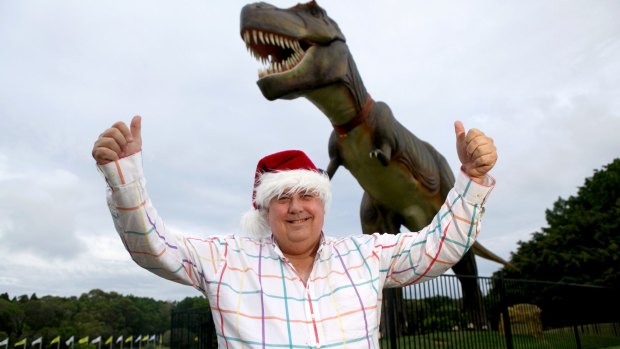 Happier days, Clive Palmer with Jeff the dinosaur at his Coolum resort. Jeff has since been destroyed by fire.