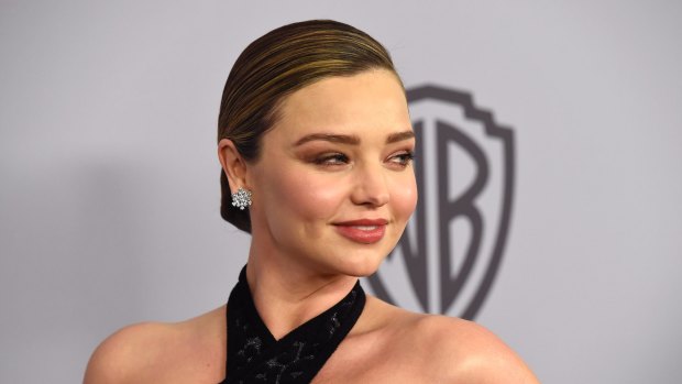 Miranda Kerr was not at home when an intruder allegedly attacked her security guard while trying to deliver a letter to her.