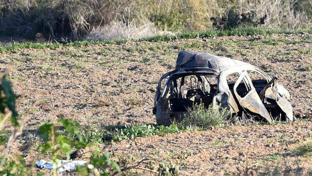 The wreckage of the car of investigative journalist Daphne Caruana Galizia in the town of Mosta, Malta.
