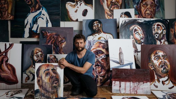 Ben Quilty with Myuran Sukumaran's paintings.