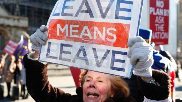 A pro-Brexit protester demonstrates outside the Houses of Parliament in London.  The British people felt they gave away too much sovereignty.