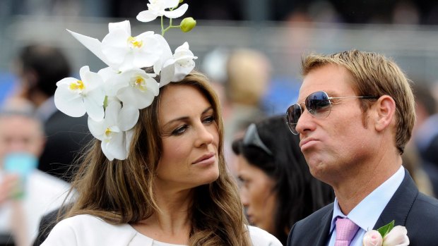 Elizabeth Hurley and Shane Warne at Crown Oaks Day in Melbourne in 2011.