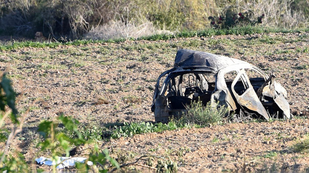 The wreckage of Daphne Caruana Galizia's car was strewn across a field after a powerful car bomb exploded.