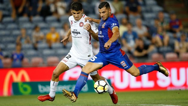 Jonathan Aspropotamitis (left) while playing for Western Sydney Wanderers last year.