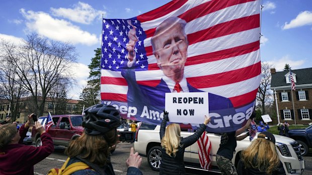 Hundreds of protesters gather outside the Minnesota Governor's official residence in St Paul.