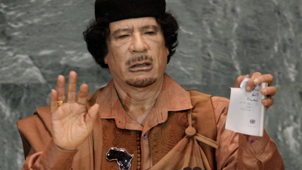 Libyan leader Moammar Gadhafi shows a torn copy of the UN Charter during his 2009 address to the 64th session of the United Nations General Assembly in New York. 