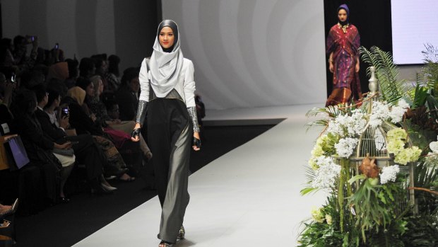 Models on the runway wearing designer hijabs at Indonesia Fashion Week.