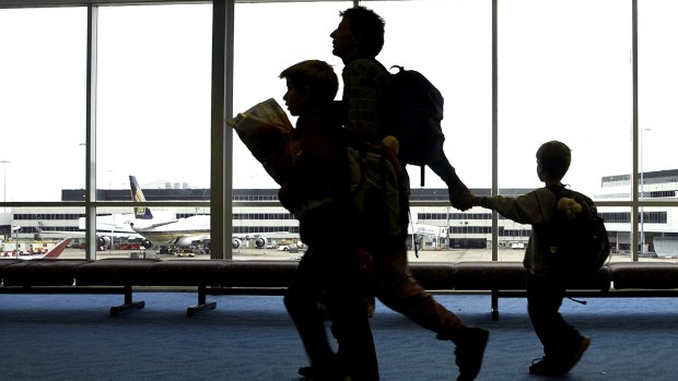 Travellers make their way through Sydney Airport. 