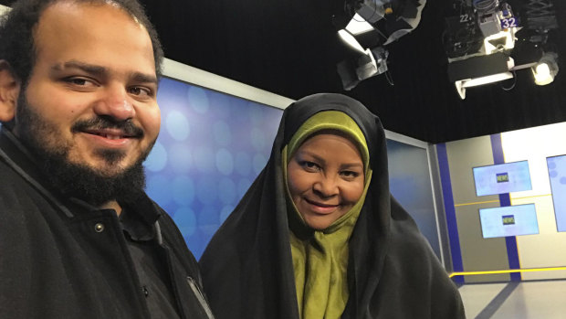 American-born news anchor Marzieh Hashemi, right, smiles as she stands with her son in Tehran, Iran. 