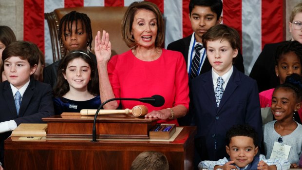 Nancy Pelosi of California, surrounded by her grandchildren,  takes the oath to become the Speaker of the House at the Capitol in Washington. 