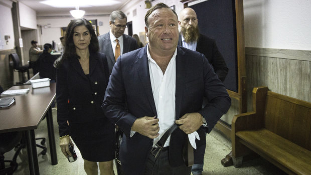 InfoWars host Alex Jones arrives at court in Texas.