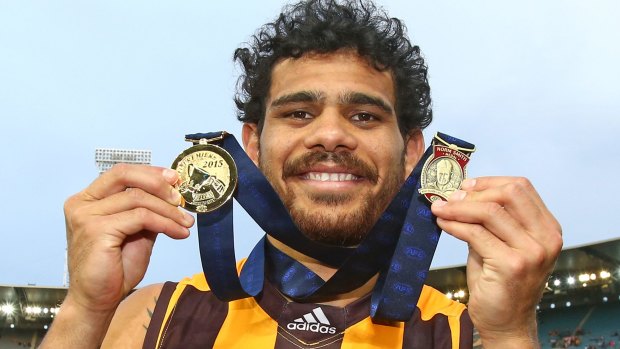 Cyril Rioli with his premiership and Norm Smith medals in 2015.