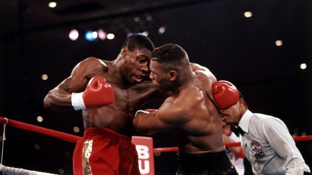 Ratings winner: Mike Tyson (right), seen here in his 1989 win over Frank Bruno, carried HBO to new heights.
