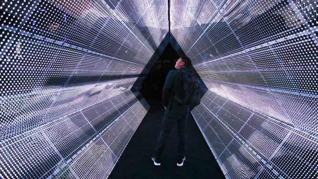 A man stands in the 5G tunnel at the Intel booth at CES International in Las Vegas