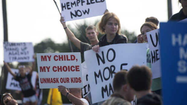 Resistance against anti-COVID measures: a group of students and parents rally in front of Hempfield Area High School in Greensburg, Pennsylvania protesting the first day of the state-wide policy requiring masks to be worn in school. 