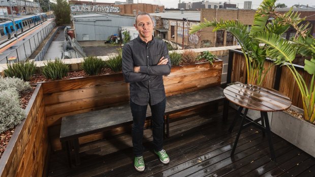 Architect Jeremy McLeod, on the balcony of his apartment in The Commons in Brunswick. Its success spawned Nightingale Housing.