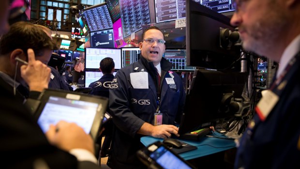 Traders work on the floor of the New York Stock Exchange. 