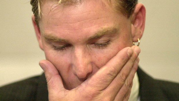 Mum's the word: Shane Warne faces the media after being suspended from cricket for 12 months in 2003. Cricket Australia want to apply the lessons of Warne's post-ban reintegration to the returns of Steve Smith and Dave Warner.
