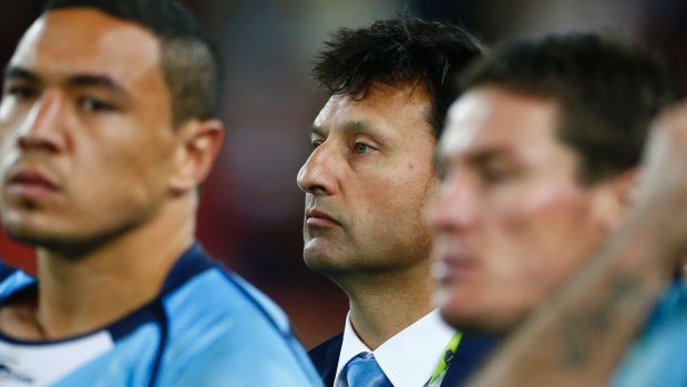 Face of defeat: Laurie Daley (centre) reflects on another Origin series defeat after game three last year.