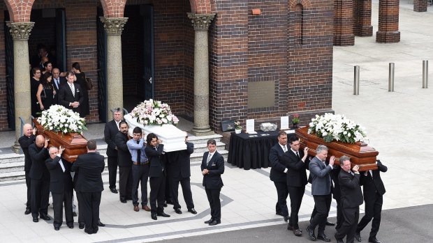 Mourners carry the coffins of Lars, Annabelle and Vivian Falkholt in January 2018.