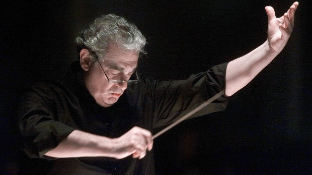 Placido Domingo directs the Washington Opera Orchestra and Chorus during a rehearsal of Verdi's Requiem in 2001.