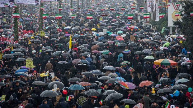 Iranians braved the rain to join in the march on Monday.