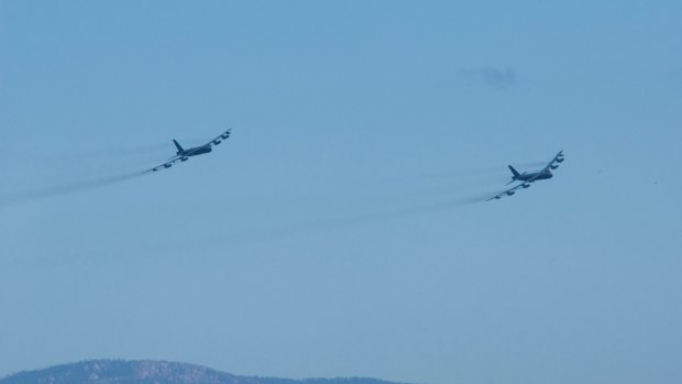 Two B-52 bombers during fly-over.