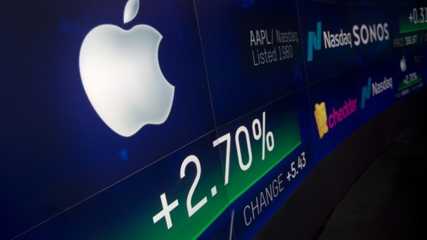 An electronic screen displays Apple stock at the Nasdaq on Thursday. Apple has become the world's first publicly traded company to be valued at $US1 trillion. 