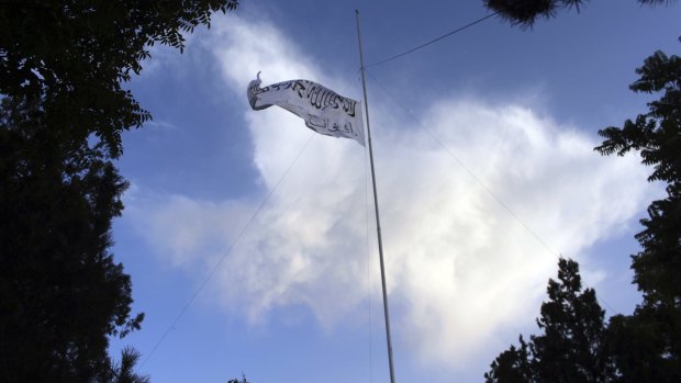 The Taliban flag flies at the Ghazni provincial governor’s house, in Ghazni, south-eastern, Afghanistan.