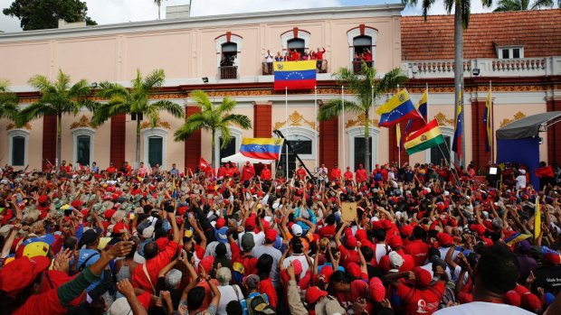 Maduro speaks to his supporters from a balcony at Miraflores presidential palace during a rally in Caracas on Wednesday.