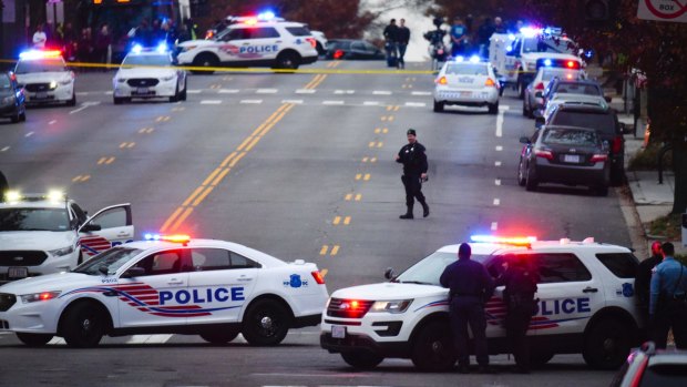 Police secure the scene near Comet Ping Pong in Washington in 2016.