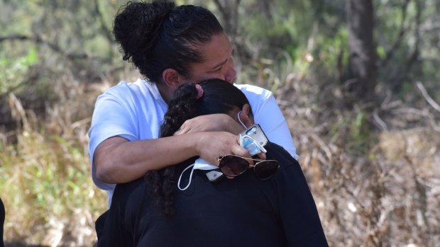 Lesley Fernando comforts Gordon’s mother Narelle Copeland during last week’s search.