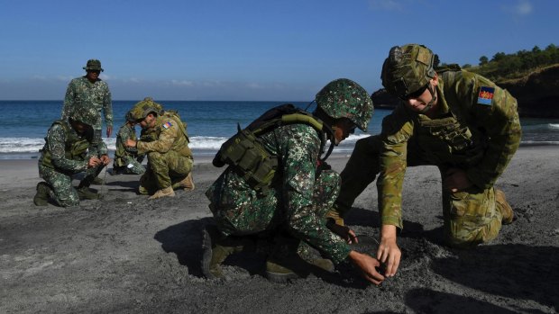 Australian Army Sapper Nicholas Field and Lance Corporal Callum Leete instruct Philippine marines during training at Marine Base Gregorio Lim.
