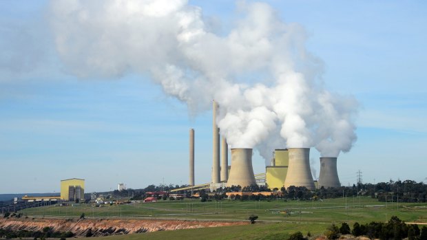 Steam billows from the cooling towers at the Loy Yang A coal-fired power station, operated by AGL Energy.