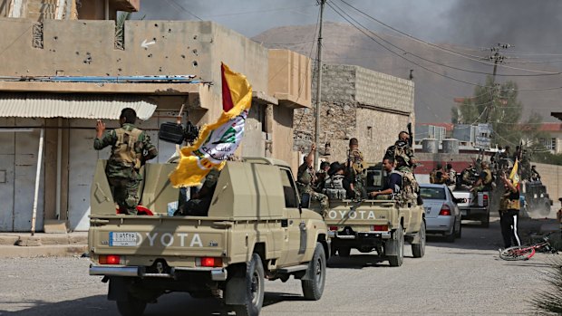 Iraqi security forces and Popular Mobilisation Forces on patrol near Kirkuk in 2017.