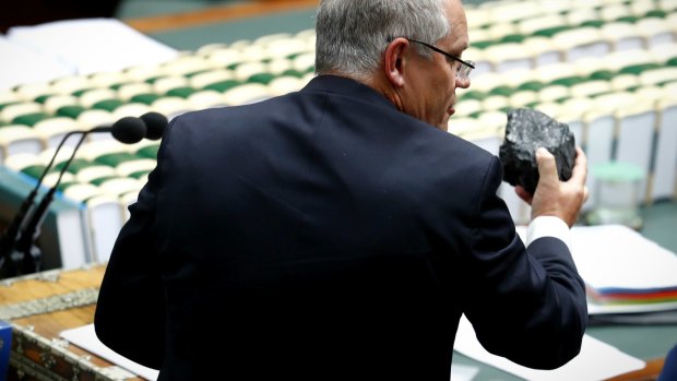 Scott Morrison, then treasurer, brandishing a lump of coal in Parliament. 