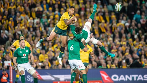 Israel Folau mistimes his attempt at the high ball before getting a yellow card.  