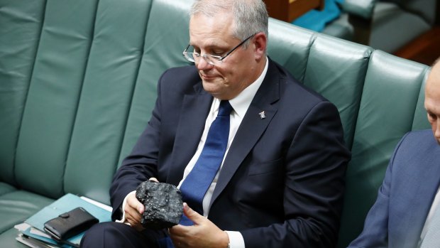 Treasurer Scott Morrison brings a lump of coal into Parliament in 2017.