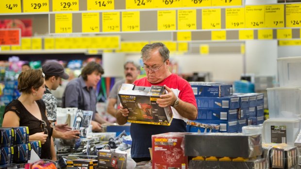 Customers inspecting products in Aldi's special buys including a cordless drill. 