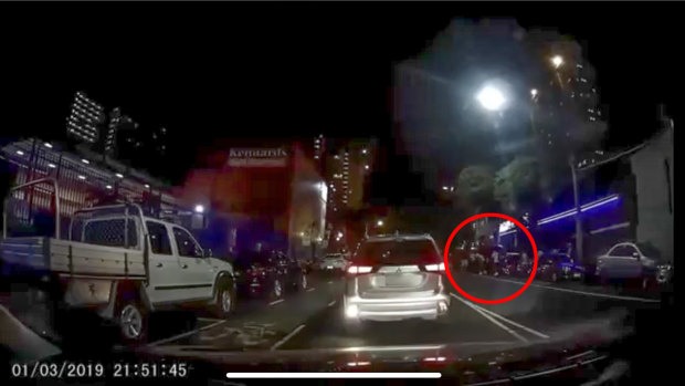 A screenshot from the dashcam footage that captured the shootings outside the Kensington boxing venue. 