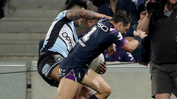 In trouble: Billy Slater after colliding with Sosaia Feki.
