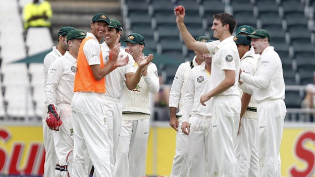 Pat Cummins (second from right) on debut in 2011 after bowling Morne Morkel. 