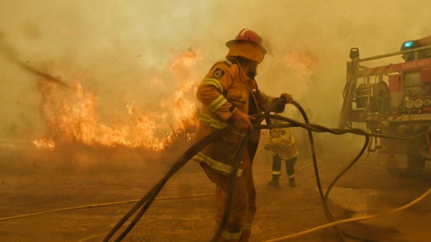 Spot fires threaten to overwhelm volunteer firefighters at the Hillville fire on NSW's Mid-North Coast in November 2019.