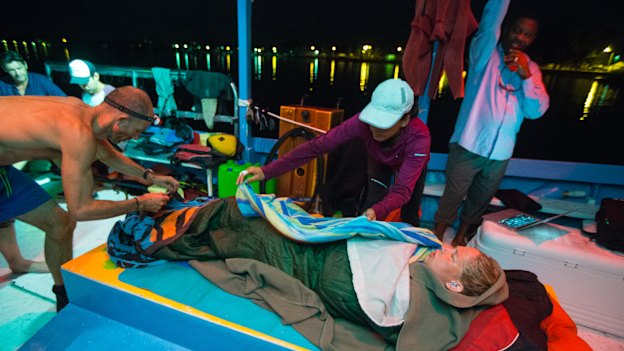 McCardel recovering on a boat after her 124-kilometre Bahamas swim – involving 41 hours straight in the water – in 2014. 