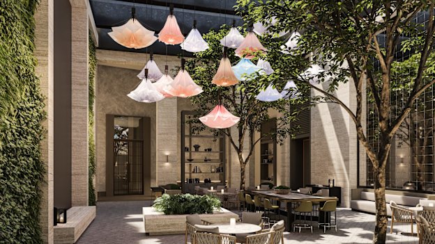 An art installation in the glass-enclosed atrium features remotely operated artificial flowers that open and close above diners’ heads.