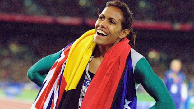 Cathy Freeman celebrates winning gold at the Sydney Olympics.
