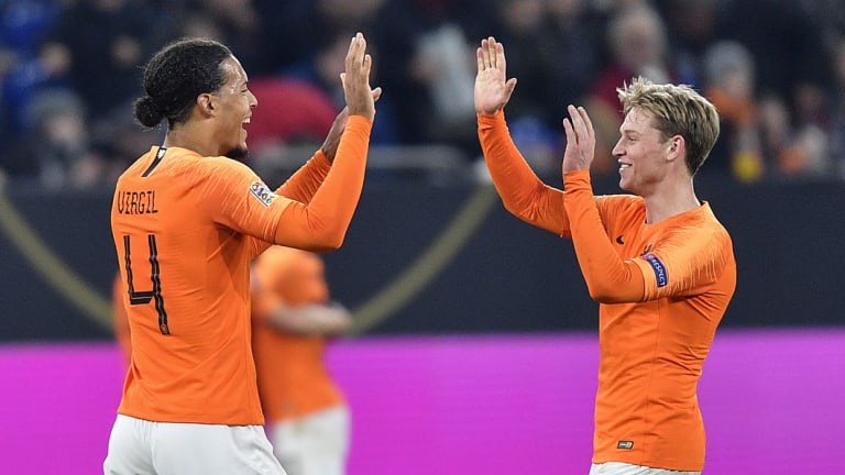 Virgil Van Dijk, left, and Frenkie De Jong celebrate the draw with Germany.