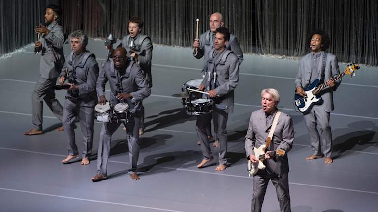Freed of risers, cables and amplifiers, the musicians roam the stage freely.